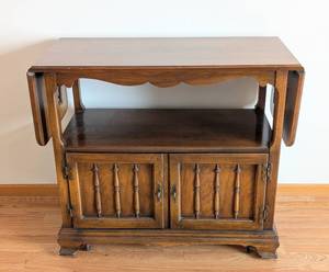 lot 15 image: Vintage Rolling Wood Buffet Server