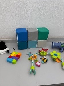 Lot of miscellaneous baby/toddler toys. Foam blocks, magnetic blocks, winter hats, box of stacking toys...