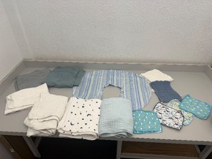 lot 31 image: Lot of baby blanketsswaddles, nursing pillow cover, burp cloths