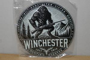 lot 99 image: Novelty Metal Sign -Winchester