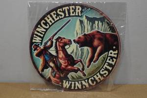 lot 102 image: Novelty Metal Sign -Winchester
