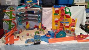 lot 300 image: Hot Wheels Ultimate Garage and Fisher Price Little People Car Ramp.