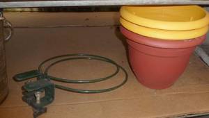 lot 331 image: 4 plastic planters, 2 clamp on deck hangers for the pots, 4 metal planters, basket, 2 birdhouses