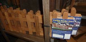 lot 352 image: TWO packages of wood fence for flower beds