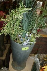 lot 7 image: Metal planter full of various sprigs of greenery