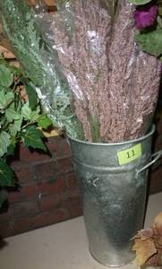 lot 11 image: Another metal planter full of colored sprigs of accent stuff