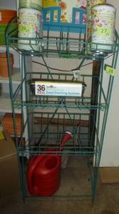 lot 28 image: Display stand with a starting system and a watering can