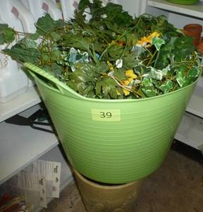 lot 39 image: Plastic basket full of greenery and a planter