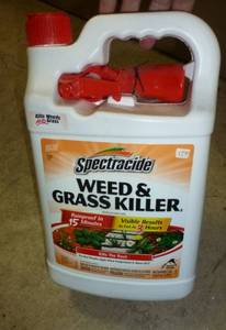 lot 89 image: Tote with a new jug of Weed and Grass Killer and 2 jugs of spreader-sticker