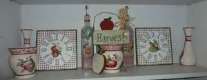 lot 101 image: Apple theme Clocks, Oil carafes, Candle holders, vases
