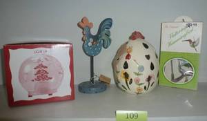 lot 109 image: chicken candle holder, light up xmas tree ball, hummingbird