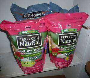 lot 117 image: 2 bags of Charcoal and 2 bags of flower fertilizer 8-5-5