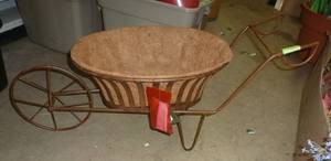 lot 128 image: Cute metal wheelbarrow planter