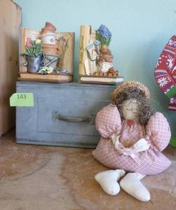 lot 143 image: Bookends, metal drawer planter and stuffed sitter