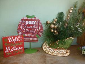 lot 144 image: Ugly sweater signs and nice holiday sleigh planter