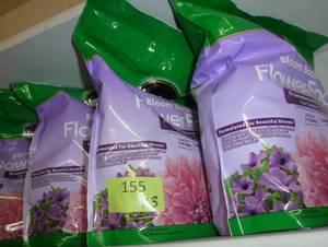 lot 155 image: THREE bags of Micracle Gro Flower Food 5 lb bags