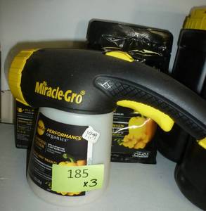 lot 185 image: Miracle Gro spray kit plus 1 box and 1 bag of fertilizer