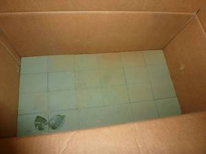 lot 203 image: Half box of flower foam and lots of silk greenery, one lit strand of pine