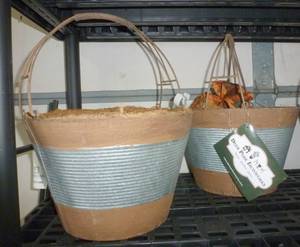 lot 209 image: TWO metal planters that look like wood and metal