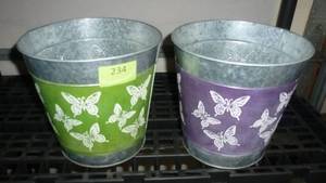 lot 234 image: TWO metal planters with butterflies