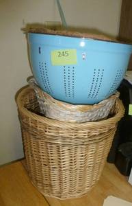 lot 245 image: Two wicker baskets and a planter that looks like a colander