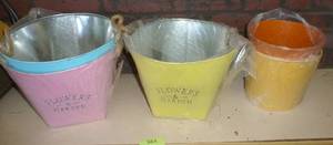 lot 384 image: FIVE metal planters of fun colors