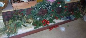 lot 390 image: Entire bottom shelf full of wreaths, empty box presents