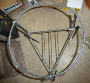 lot 394 image: One metal plant stands 23 inches tall 12 inch diameter, and One 35 inches tall
