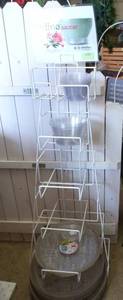 lot 439 image: Display stand with lots of plastic water pans and liners