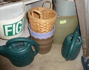 lot 491 image: 5 new plastic planters, wicker basket and 1 terra cotta glazed planter and 2 used waterers