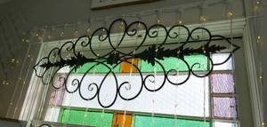 lot 544 image: Pretty black iron scroll dcor for over your window or wall
