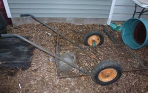 lot 557 image: Flat bottom 2 wheel cart to haul plants and stuff