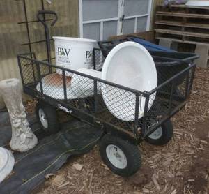 lot 560 image: Mesh sided garden wagon - does not include contents