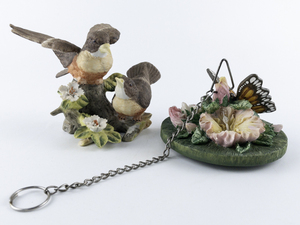 lot 107 image: Set of Two Porcelain Bird and Butterfly Figurines