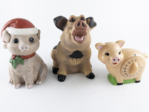 lot 154 image: Door Greeting Motion Activated Snorting Pig, Pig Timer, & Garden Pig Figurine