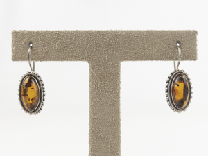 lot 9 image: Baltic Amber Elongated Oval Cabochon Sterling Silver French Wire Earrings .