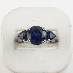 lot 30 image: Three Stone Lab Grown Blue Sapphire Sterling Silver Ring. Size 7 - 7.25.