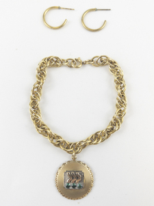 lot 65 image: Gold Filled Charm Bracelet.
