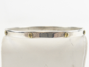 lot 72 image: Screw Head Two-Tone Sterling Silver Hinged Bangle.