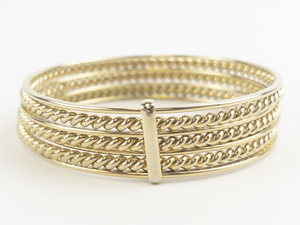 lot 75 image: Linked 7 Layered Gold Tone Base Metal Bangle Bracelet.