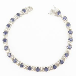 lot 85 image: Oval Cut Tanzanite Sterling Silver Tennis Bracelet.