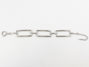lot 86 image: Rectangular Link Silver Tone Base Metal Bracelet.
