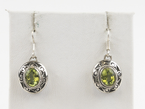 lot 101 image: Oval Cut Peridot Silver Tone Base Metal French Wire Earrings .