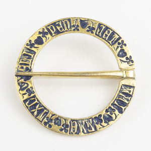 lot 115A image: Celtic Enamel Blue & Gold Tone Base Metal Brooch .