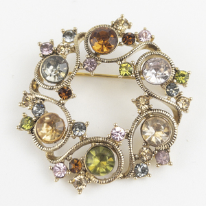 lot 120 image: Monet Multi-Color Rhinestone Gold Tone Base Metal Wreath Brooch .