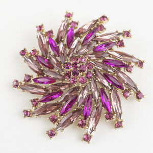 lot 131 image: Pink Rhinestone Floral Gold Tone Base Metal Brooch .