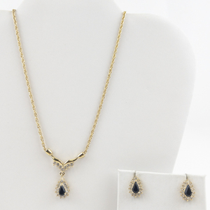 lot 157 image: Roman  White Rhinestone Accented & Onyx Gold Tone Base Metal Necklace & Earrings Set.