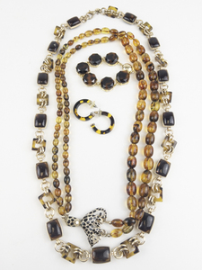 lot 172 image: Group of 4  Tortoise Gold Tone Base Metal Bead Necklaces, Bracelet, & Earrings.