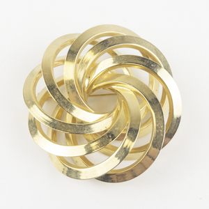 lot 126 image: Huge Round Modernist Swirl Gold Tone Base Metal Brooch .