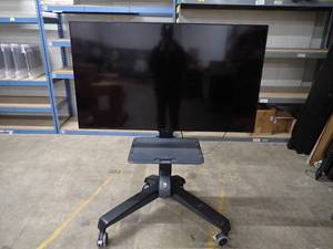 lot 83 image: Sharp&nbspAquos LC-60LE660U Smart TV on Mobile Media Cart  TV has 60 screen with 1920 x 1080 HD Resolution &nbspminor scratches on screen, minor scratches and major blemishes  Includes remote and power cable 